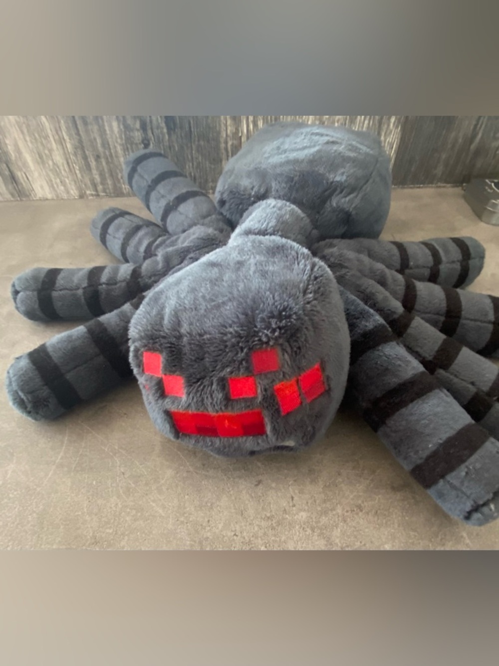 Gray Plush Spider Toy with Red Pixel Face